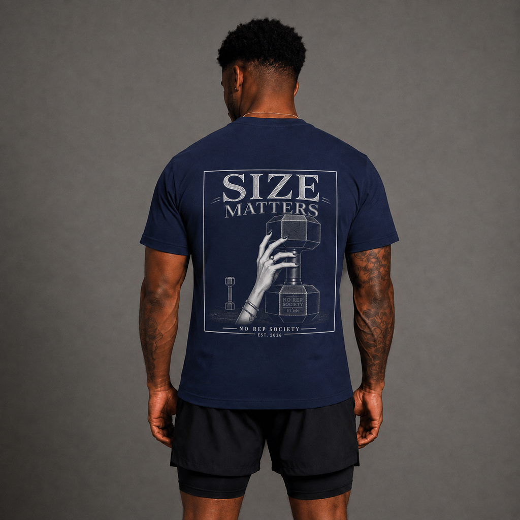 Navy Size Matters Tee by The No Rep Society, worn by a male model, back view showing the SIZE MATTERS print.