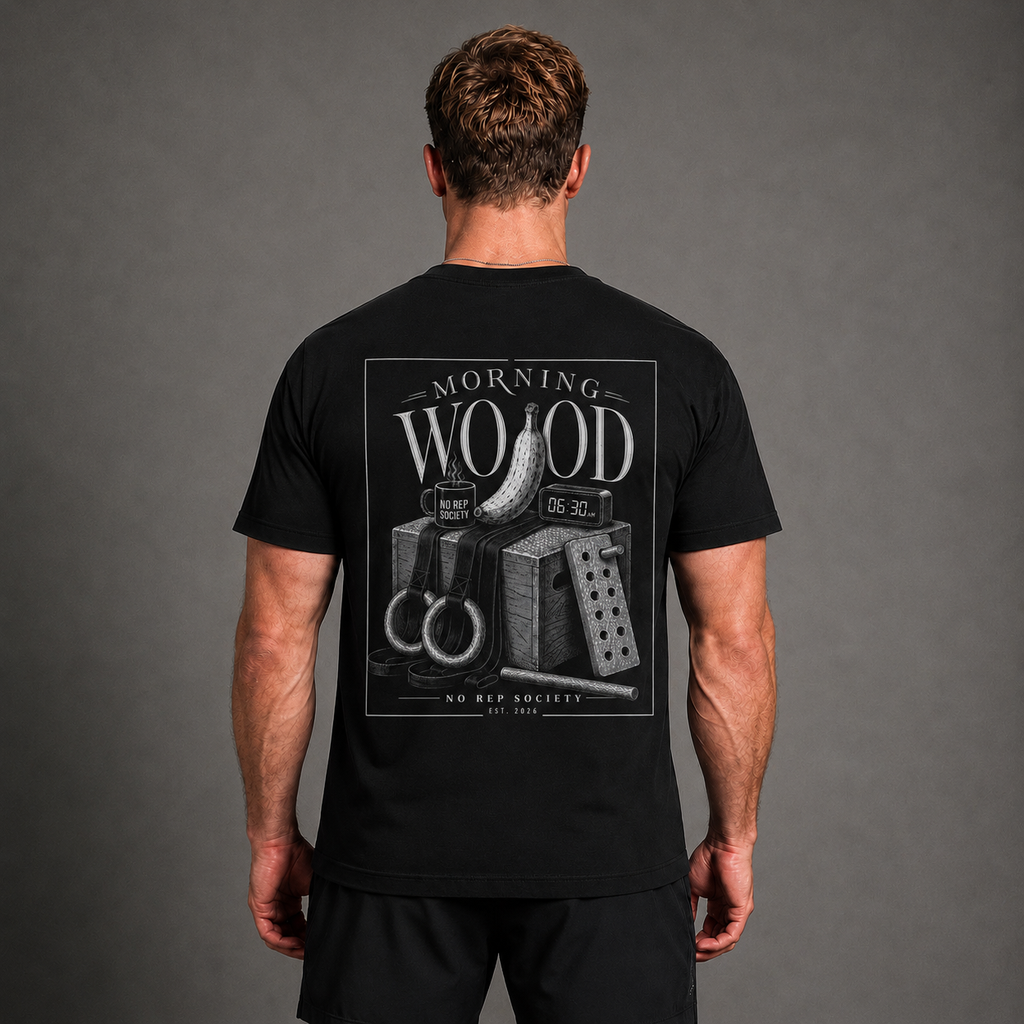 Black Morning Wood Tee by The No Rep Society, worn by a male model, back view showing the MORNING WOOD print.