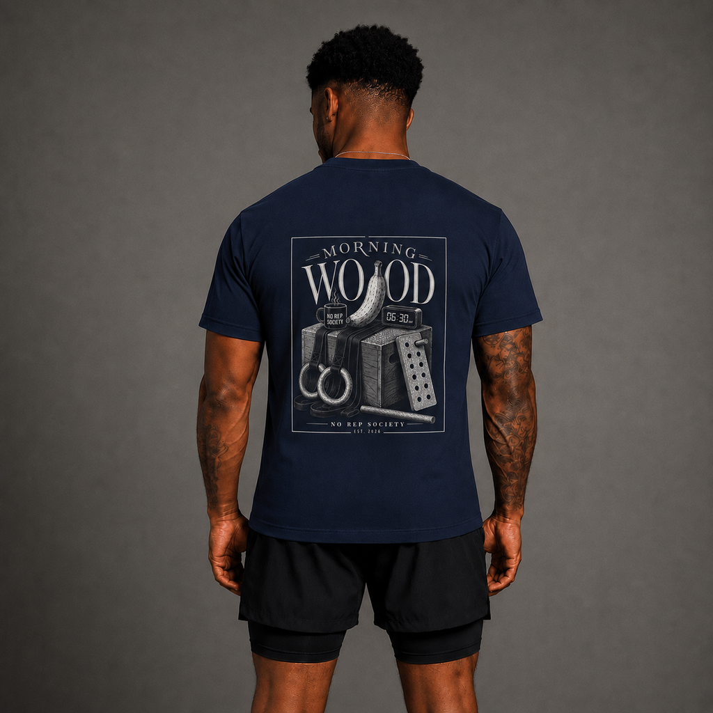 Navy Morning Wood Tee by The No Rep Society, worn by a male model, back view showing the MORNING WOOD print.